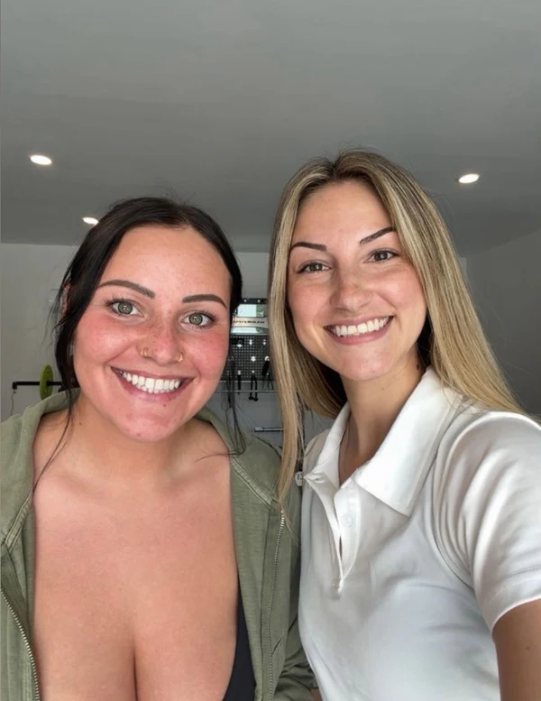 Two OpenbooQ team members smiling in a selfie