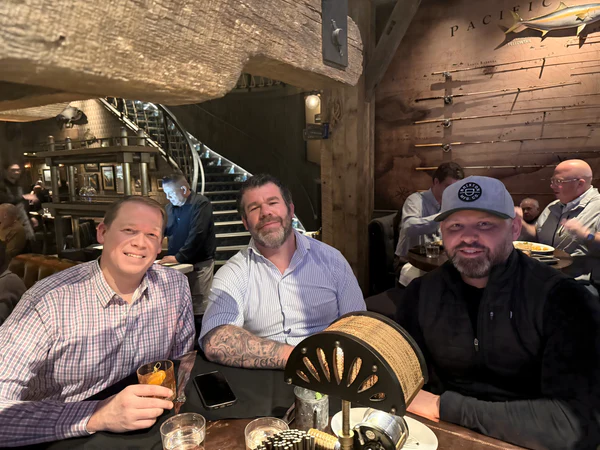 OpenbooQ founders at a bar